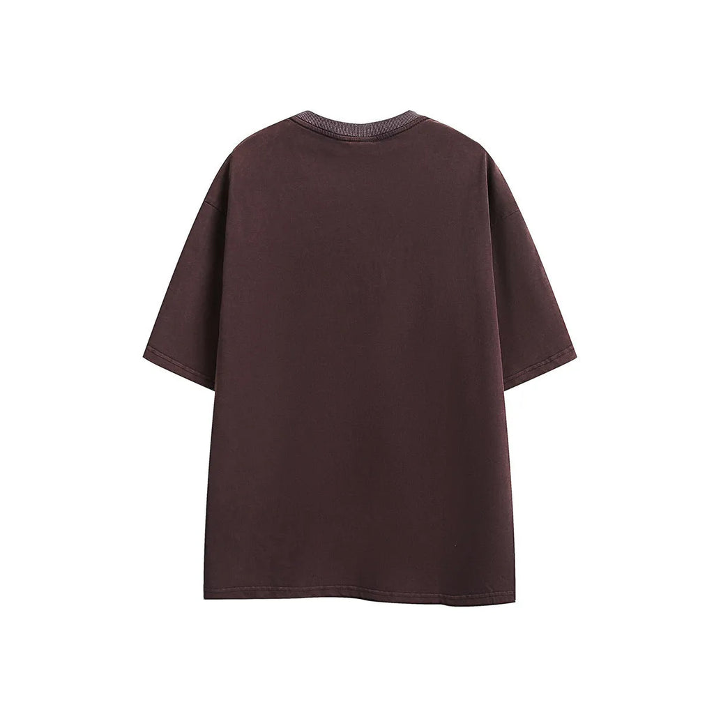 Man's loose fit retro half-sleeve t-shirt with embroidered wash finish in purple.