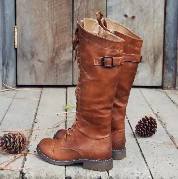 Black women's high leg boots with a low chunky heel and round toe made from artificial PU.