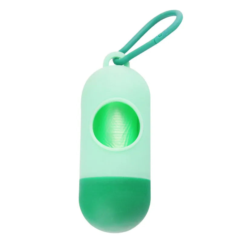 Small, lightweight dog poop bag holder showing side hook and Velcro strap for attachment.