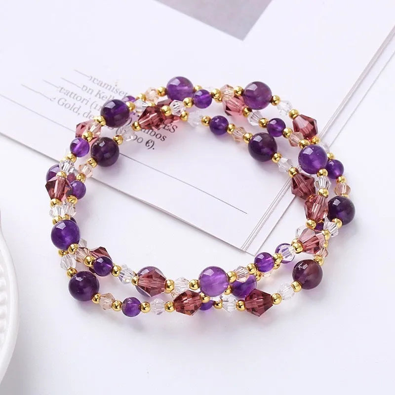 Women's adjustable three-ring crystal bracelet in tourmaline, strawberry quartz, or amethyst on cord.