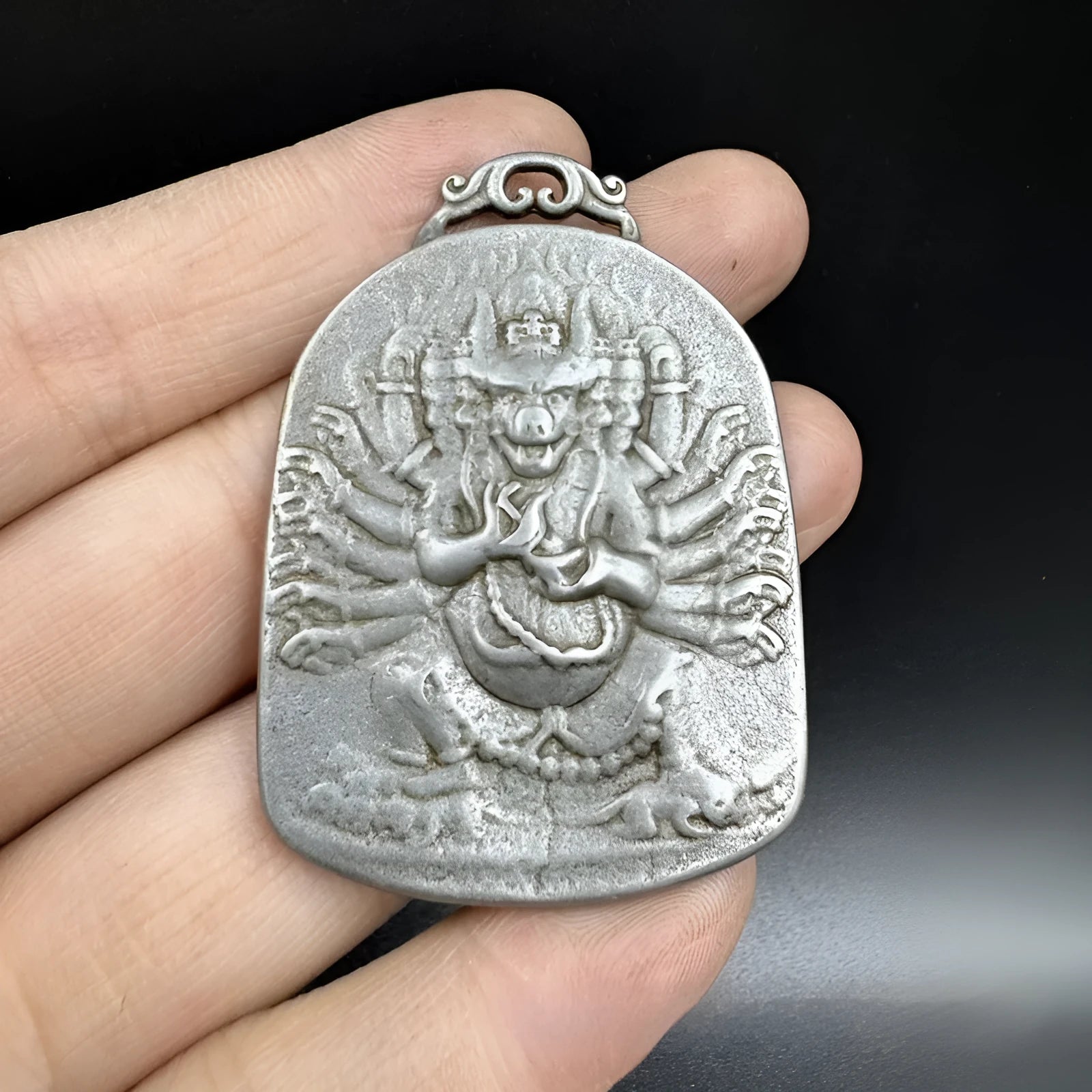 Chinese style geometric iron metal hanging pendant ornament for display.