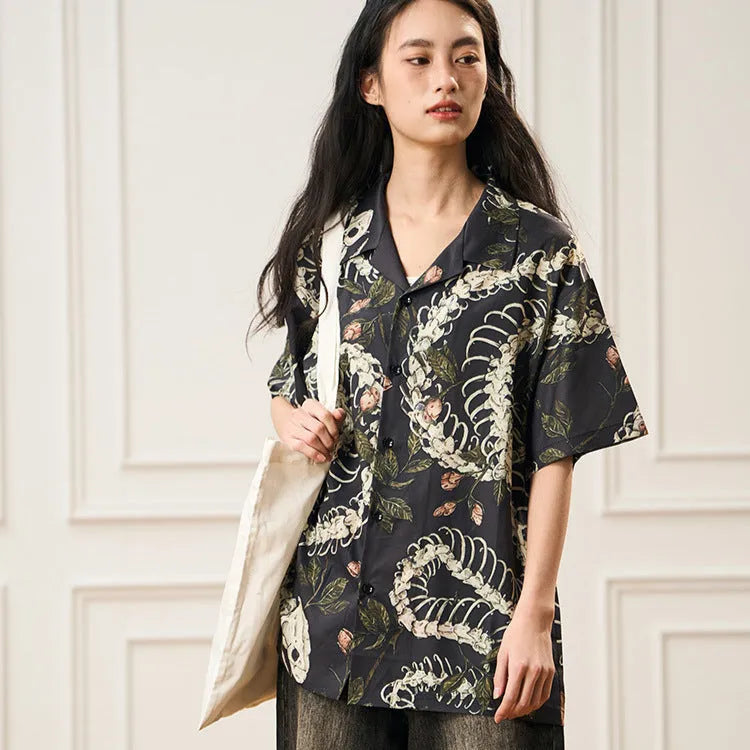 Short sleeve loose fit Cuban collar shirt with snake bone and floral printed pattern in various colours.