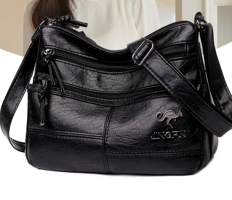 Crossbody shoulder bag in soft textured PU, black, 25x17x9cm, with sandwich pocket