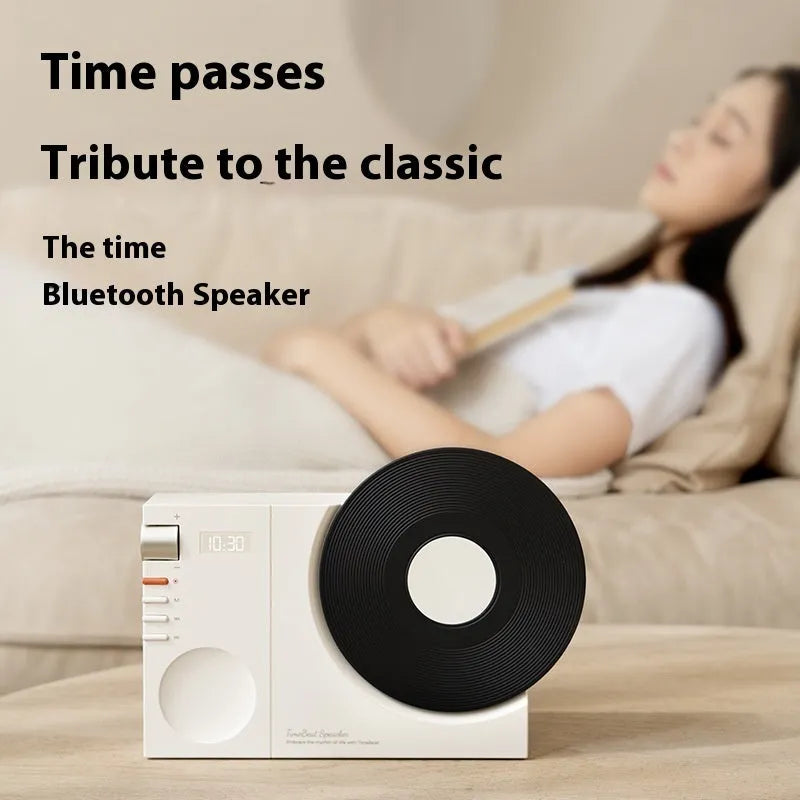 Mini portable Bluetooth speaker in Obsidian Black with USB charging port and card insertion slot.