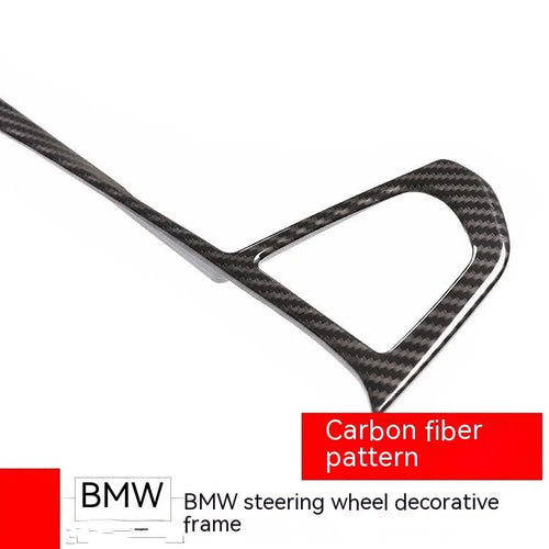 Carbon fibre pattern ABS plastic overlay frame for BMW steering wheel buttons.