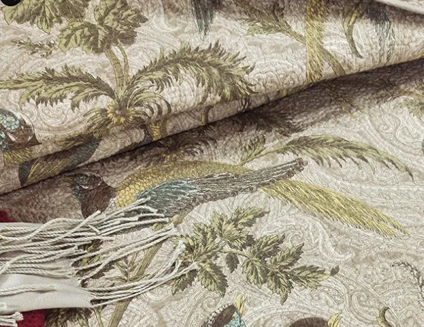 Blue American floral and bird pattern quilted cotton bedspread set on a double bed