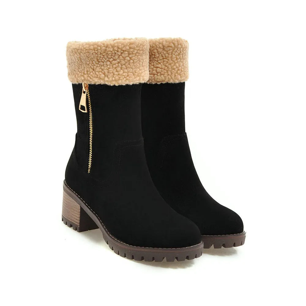 A pair of ankle-height snow boots in black, shown with a short plush lining and rubber sole, on a white background.