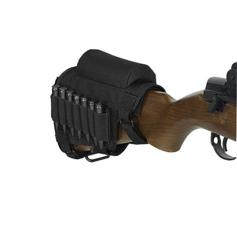 Tactical cheek rest with black nylon surface, hook and loop straps, and removable ammo carrier attached to a rifle stock