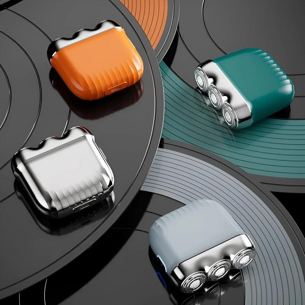 A mini three-head magnetic electric shaver in gun colour, orange, green, or blue, shown with its floating cutter head.