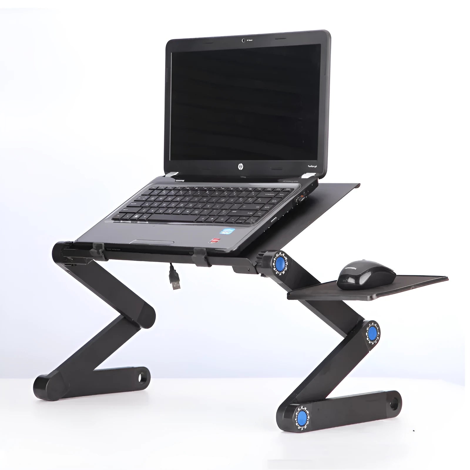 Black folding laptop table stand with six legs, magnesium alloy desktop, and attached mouse pad, folded view on a desk