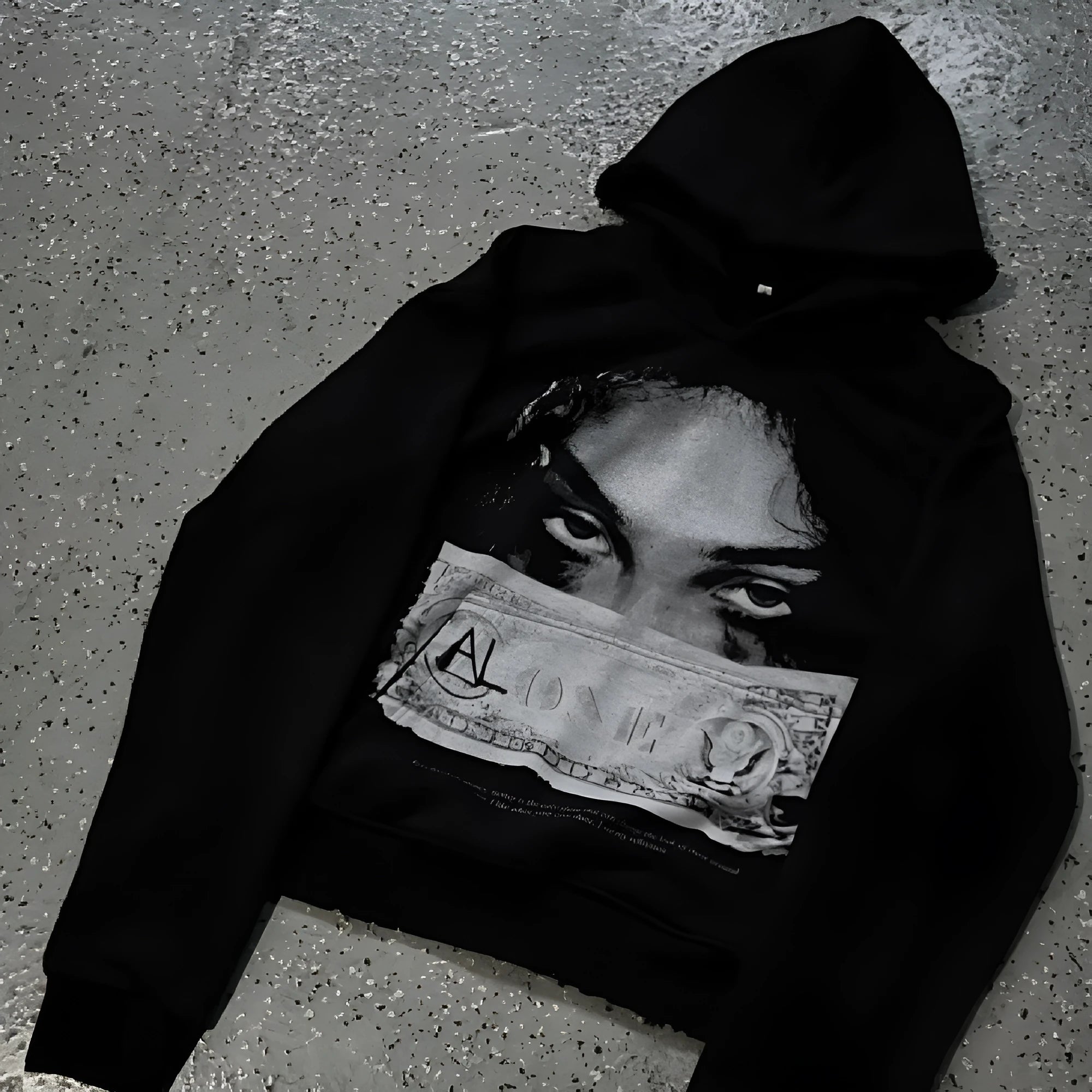 Black women's loose-fit hoodie with a cartoon print, shown in a casual setting.