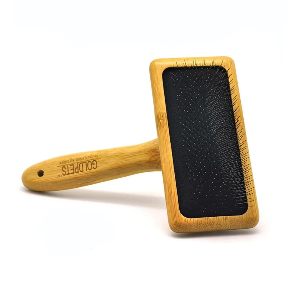 Goldpets bamboo slicker brush with wooden handle and 304 stainless steel pins on a light background