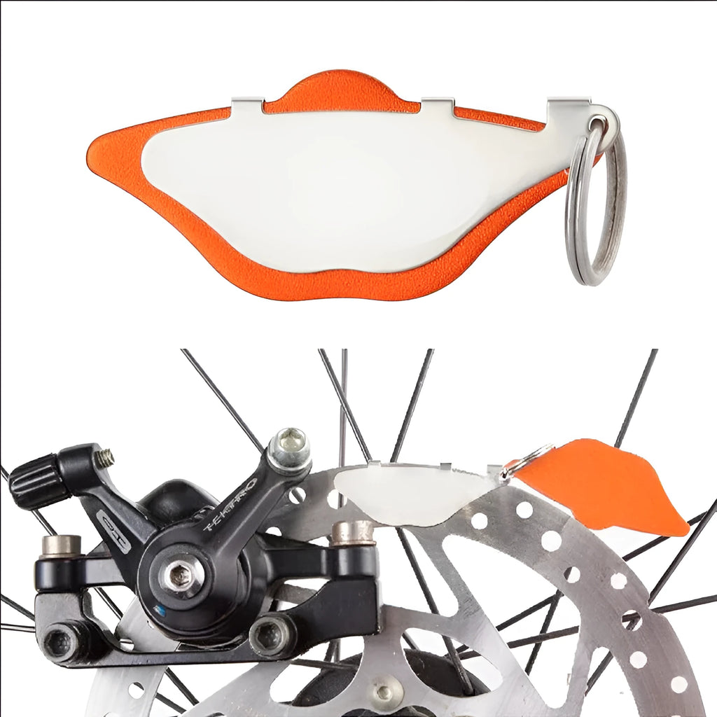 Mountain bike brake pad grinding disc kit in black or orange with adjustment flap.