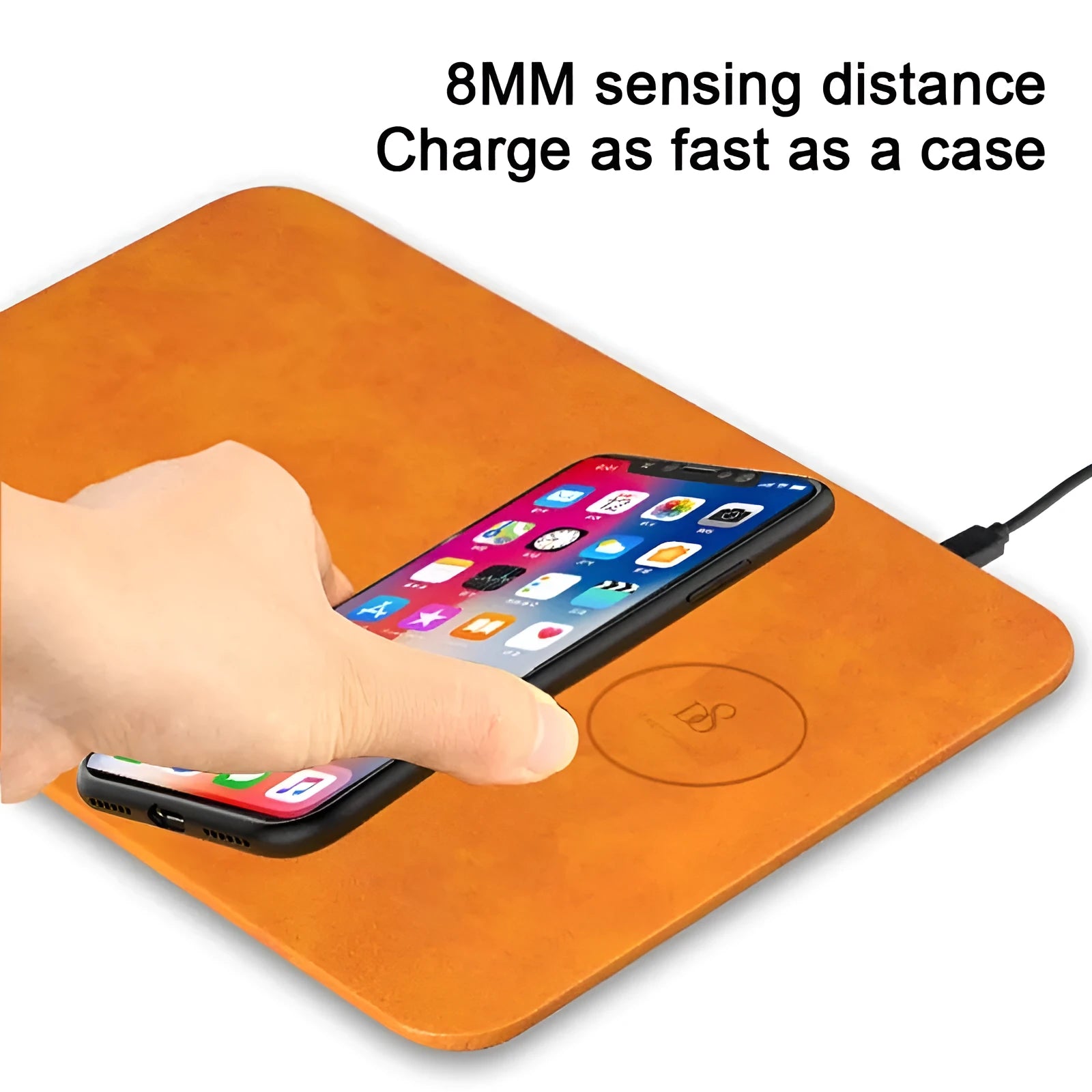 Brown leather-textured wireless charging mouse pad with a smartphone placed on it, showing a Micro USB port on the side.