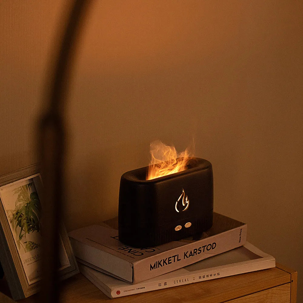 White flame aroma diffuser with 230ml tank, USB cable, on a wooden table, showing mist and flame effect