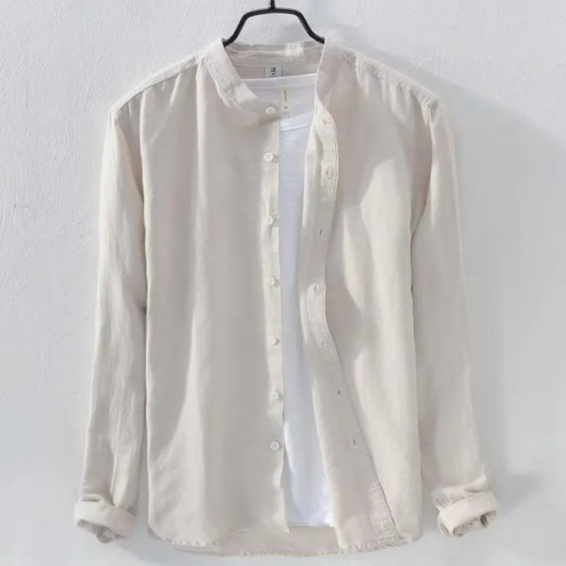 A man wearing a loose-fitting long sleeve linen casual shirt in a solid colour.