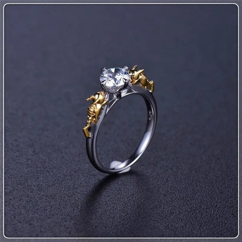 Detailed black gold copper crown ring on a finger, showing crown modelling and metallic finish.