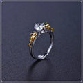 Detailed black gold copper crown ring on a finger, showing crown modelling and metallic finish.
