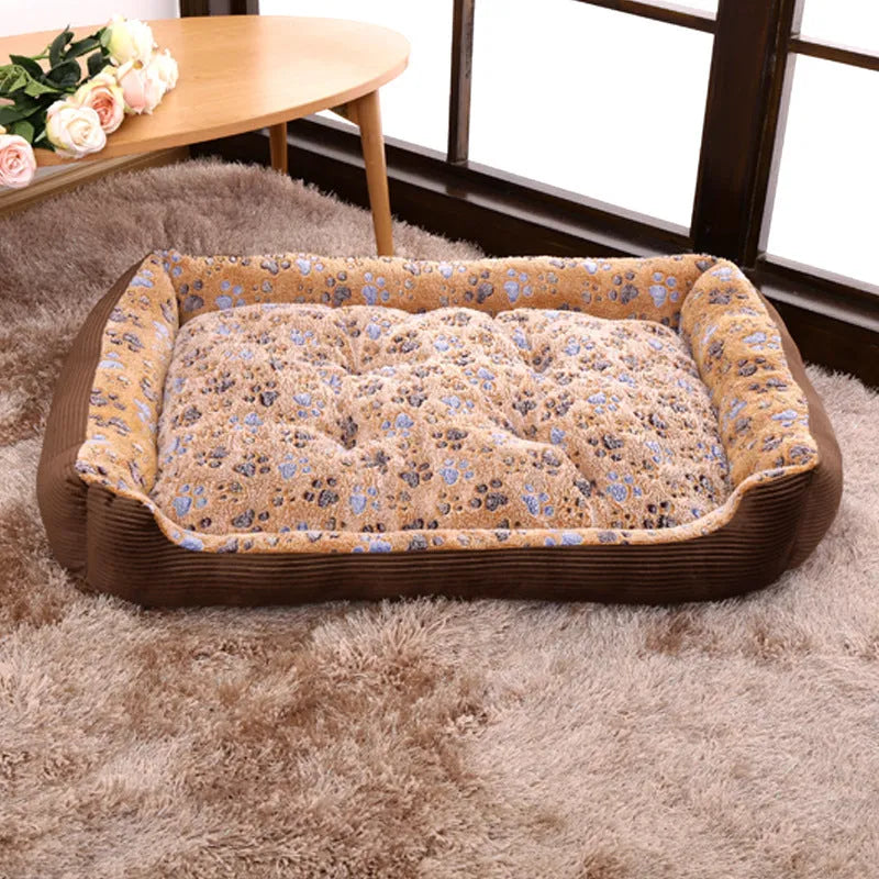 Beige plush sofa dog bed with raised rim for a small dog, showing non-slip base.