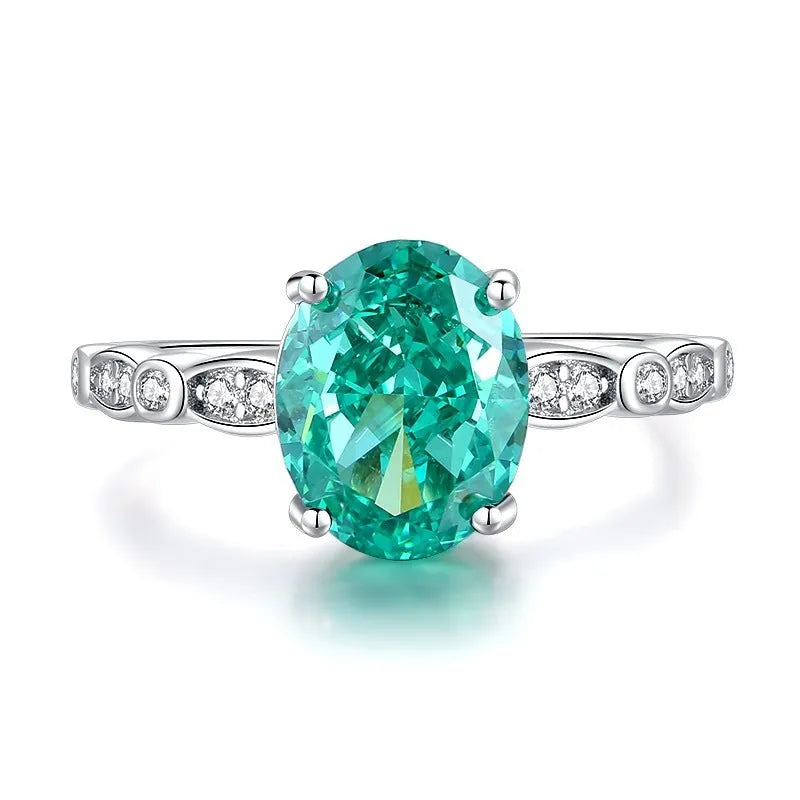 S925 sterling silver women's ring with ellipse emerald and inlaid high carbon diamond in geometric setting.