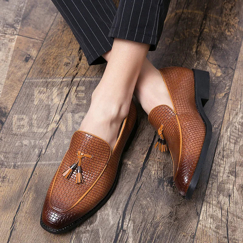 Men's black pointed slip-on business shoes with tassel detail on artificial PU upper