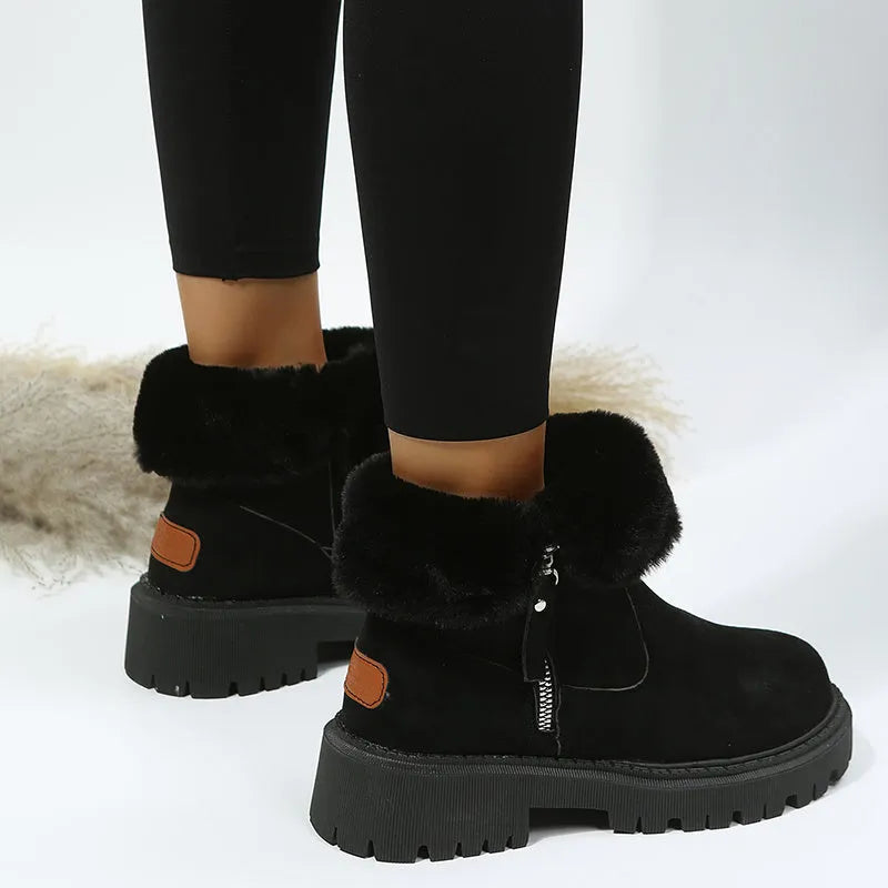 Women's black thick plush snow boots with side zipper and faux suede upper on a non-slip rubber sole.