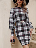 A black tight-fitting midi dress with loose lantern sleeves and decorative leather stitching on the front.