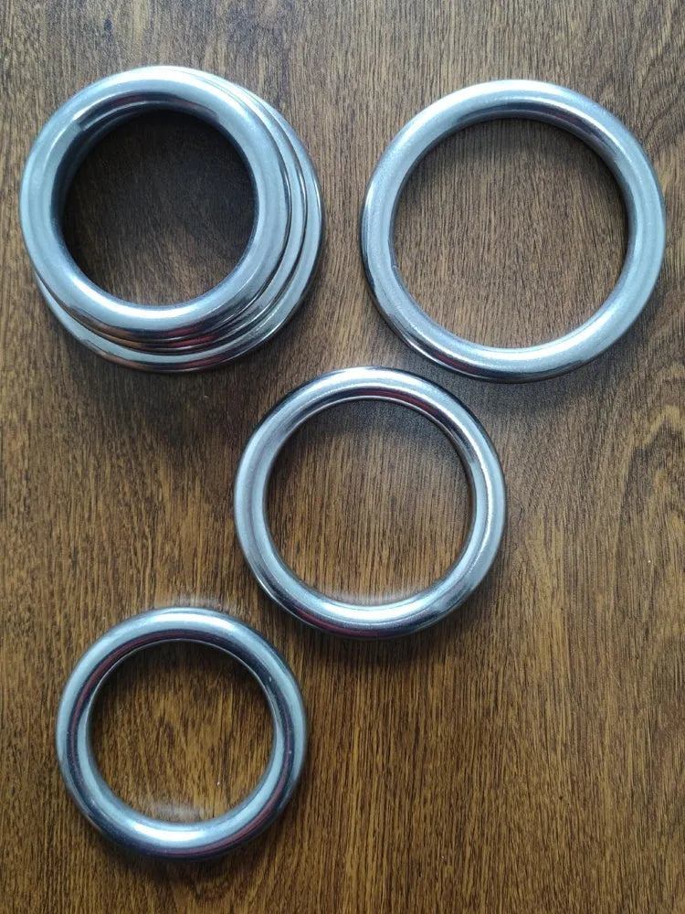 A silver carbon steel ring for Wing Chun iron arm and hand grip strength training.