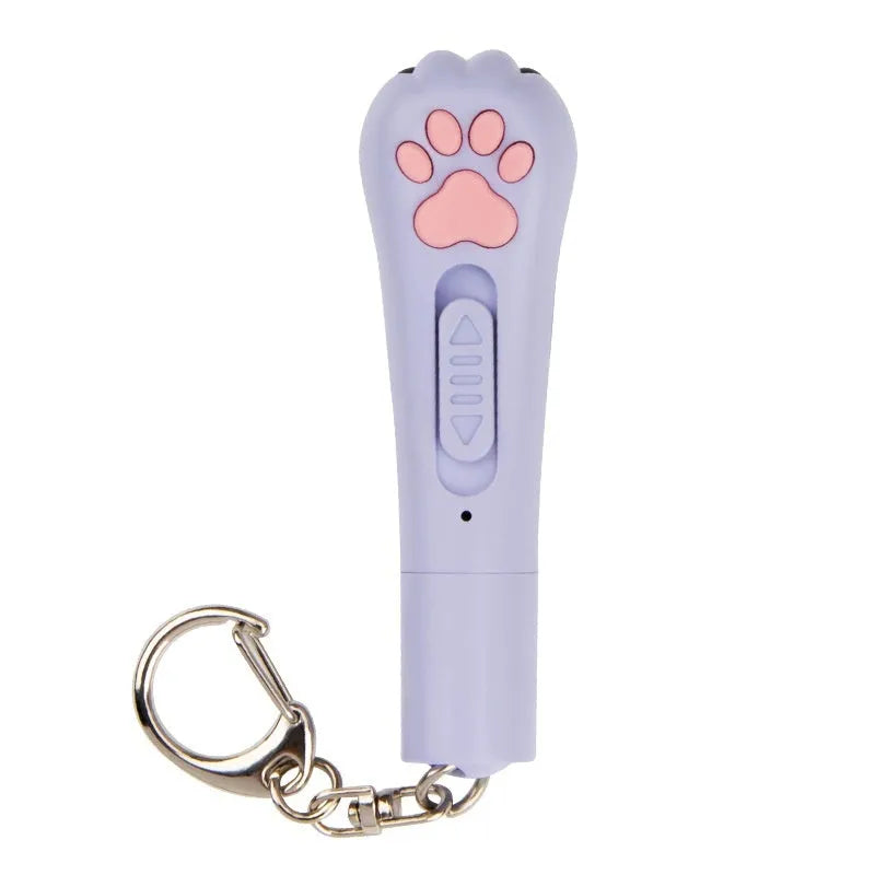 USB-rechargeable infrared laser cat toy wand in pink, projecting a cat footprints laser pattern on a floor.