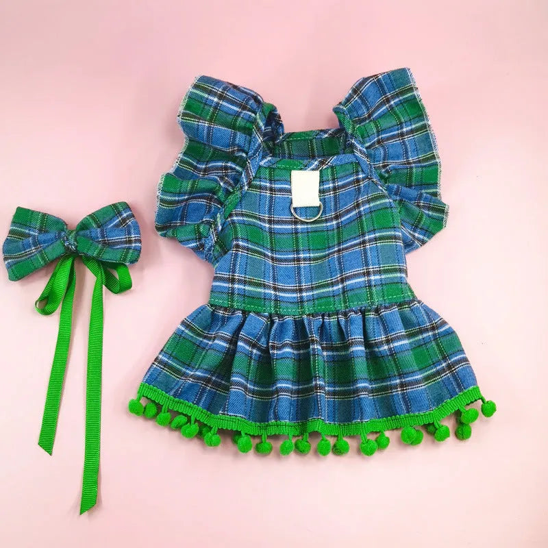 Red tartan Christmas skirt outfit with bow tie and head flower on a cat