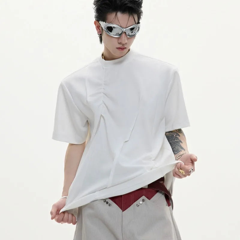 Men's loose-fit grey cotton T-shirt with pleated asymmetric stitching detail on the front, round neck, short sleeves.