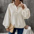 Milky white women's pullover sweater with a polo collar and textured knit fabric