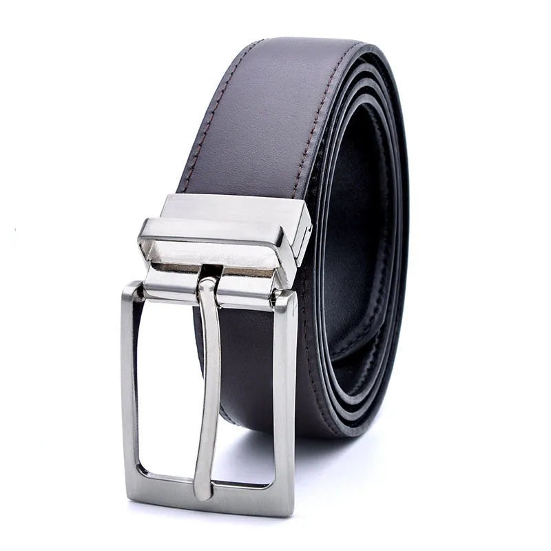 Men's dark brown and black genuine leather belt with a silver rotating pin buckle shown on a table.