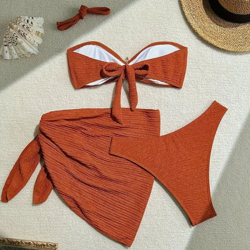 Three-piece brown polyester swimsuit set with tube top, pants, and skirt for women