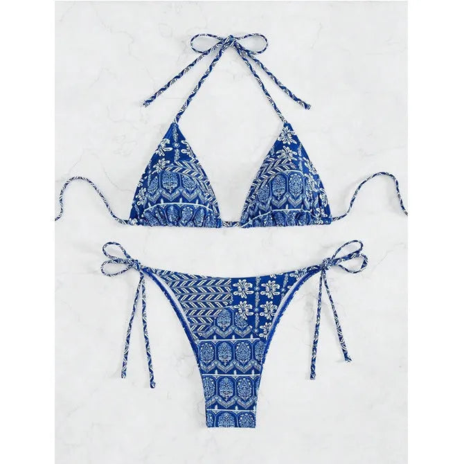 Women's green split bandage bikini with printed stitching on a mannequin.