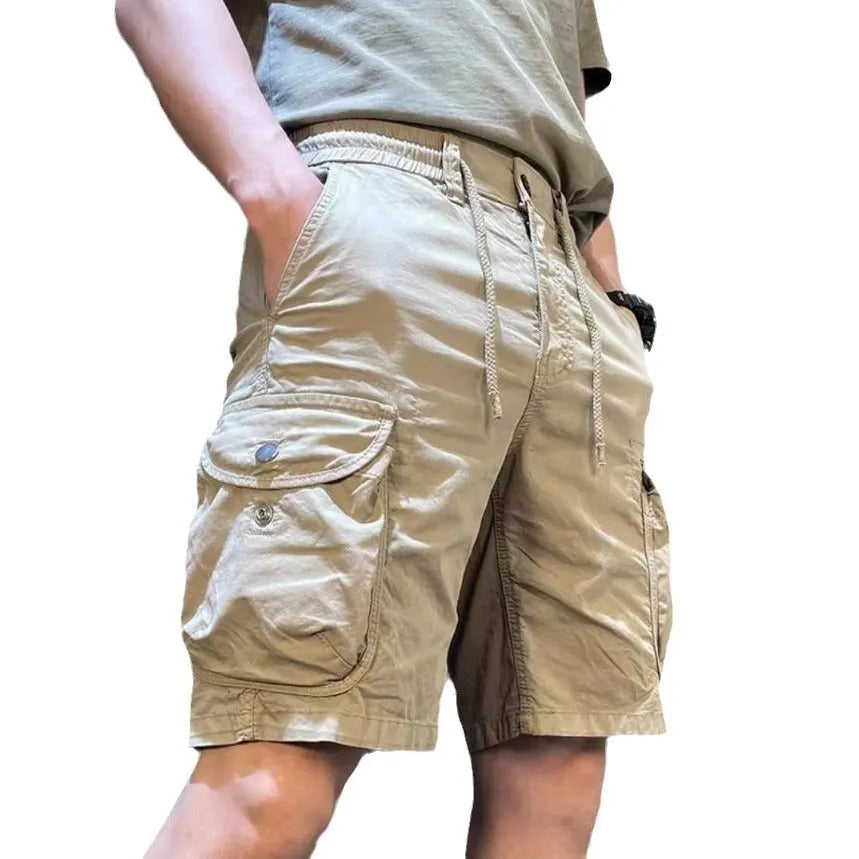 Korean style loose straight-leg overalls in khaki with multiple pockets and elasticated waistband.