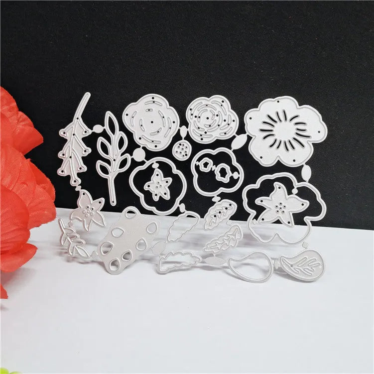Silver carbon steel flower cutting die with plant etching pattern measuring 14.3 by 9.9 cm