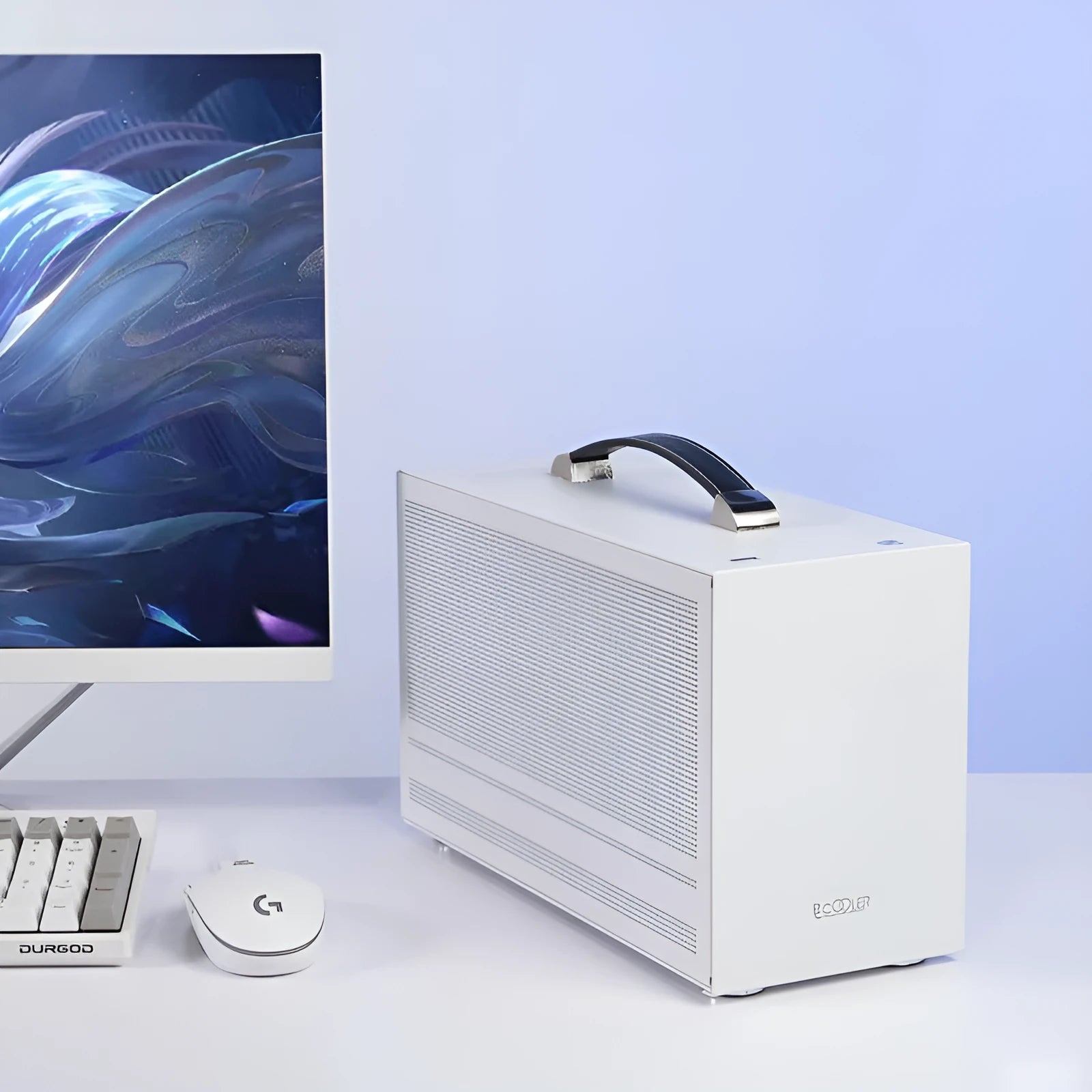 Three Hummingbird Portable mini-ITX steel computer case in titanium grey on a desk