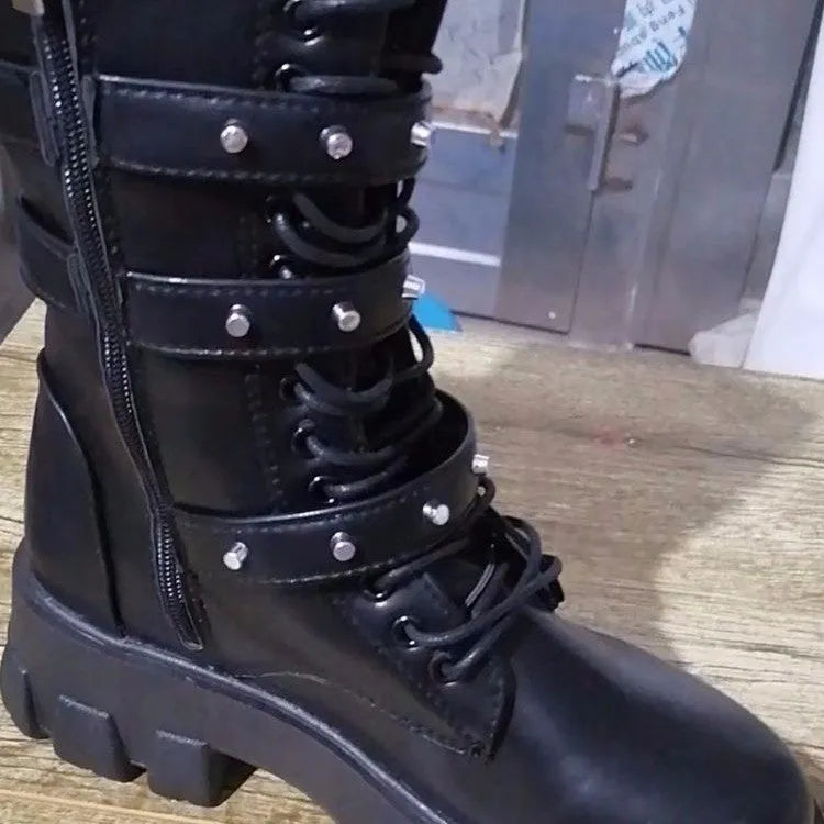 Black women's mid-calf boots with a metal buckle strap and side zip on a round toe.