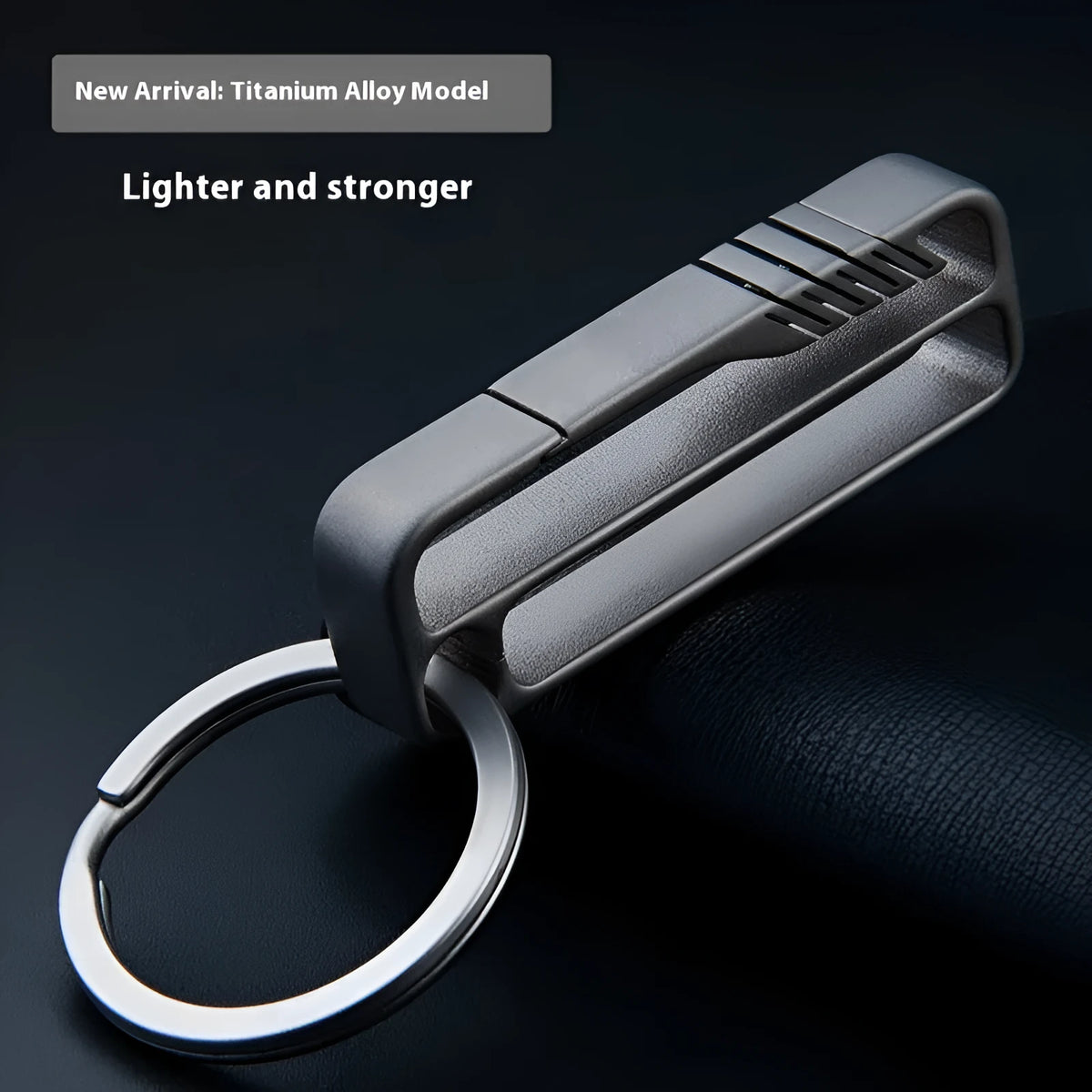 Titanium alloy key ring pendant with black buckle belt attachment, shown in sizes 9mm, 13mm, 17mm, and 21mm
