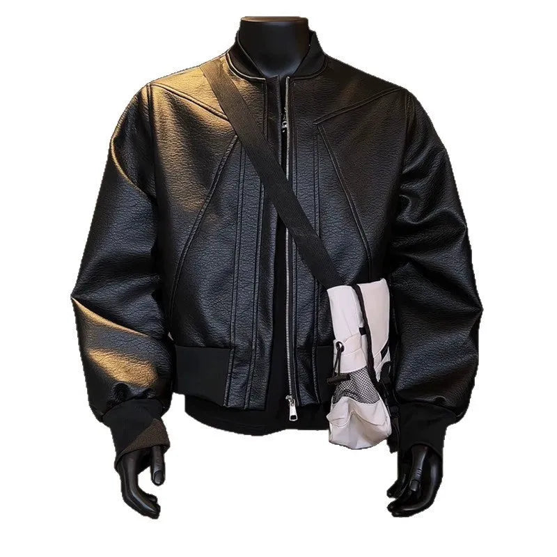 Man wearing a long black PU leather jacket with a tight fit and light business style.