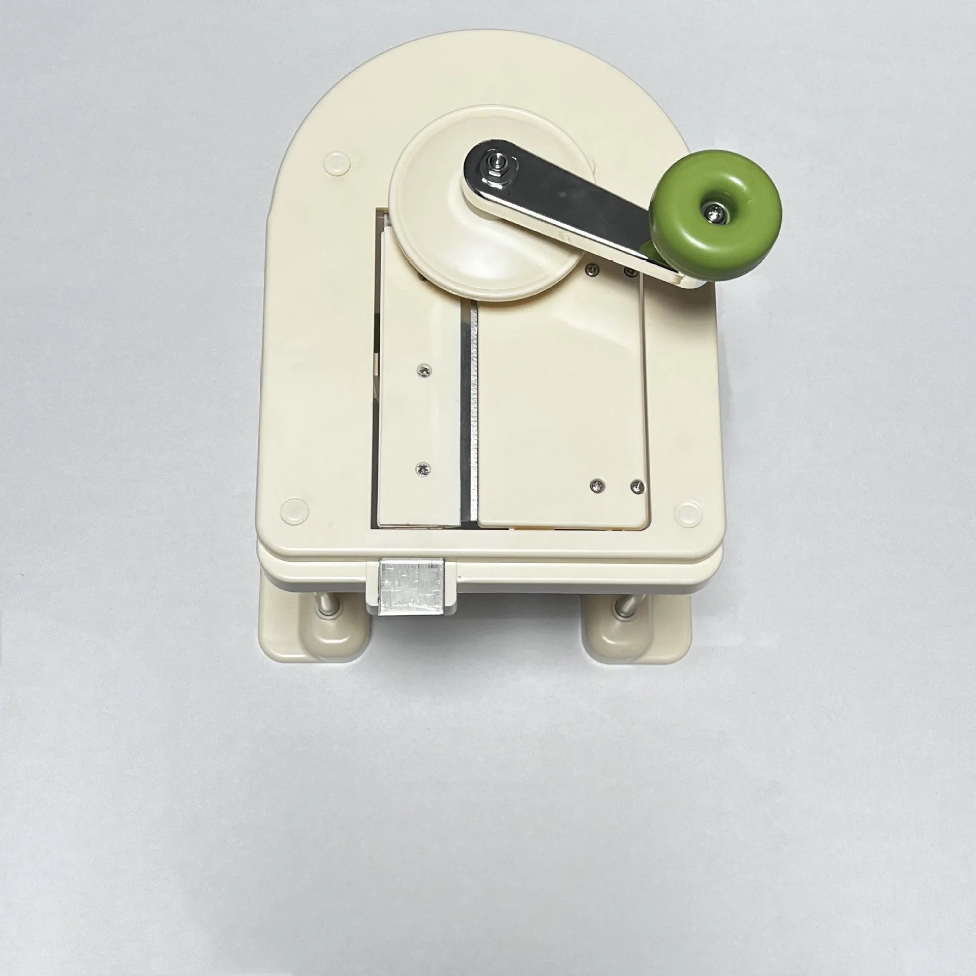 Beige kitchen vegetable slicer and grater with stainless steel blades for healthy meal preparation