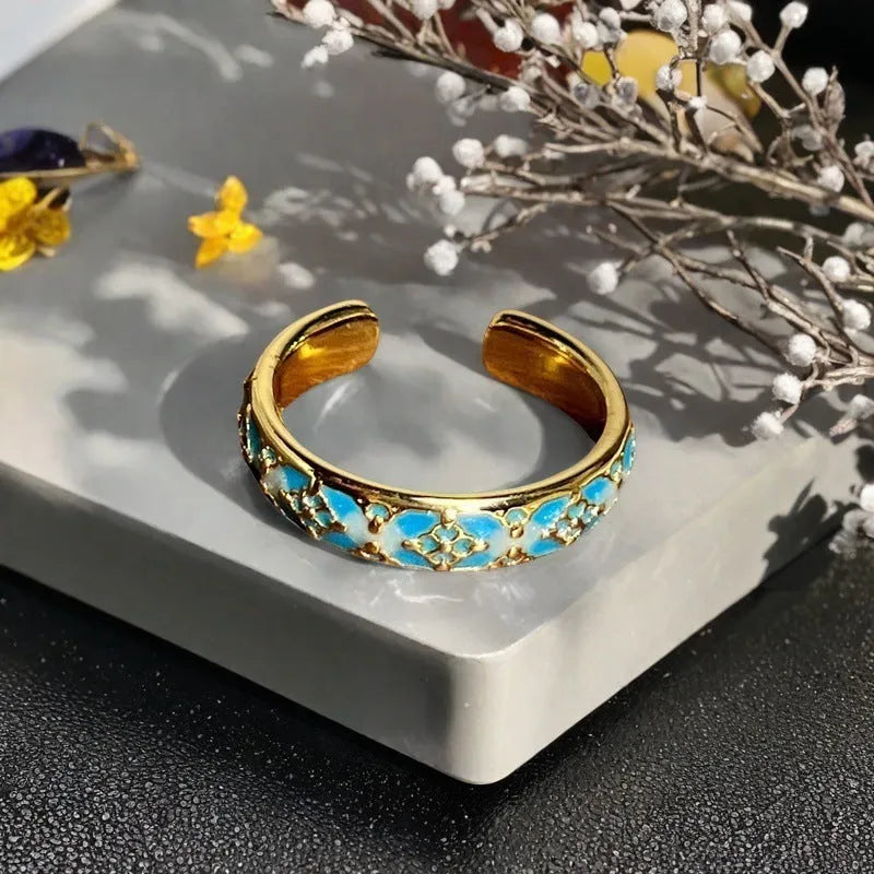 Adjustable copper ring with vintage gourd, floral, and bow design in New Chinese style, set with zircon stones.