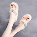 Women's high-heeled flip-flops with cotton cloth upper in beige colour showing casual summer footwear design