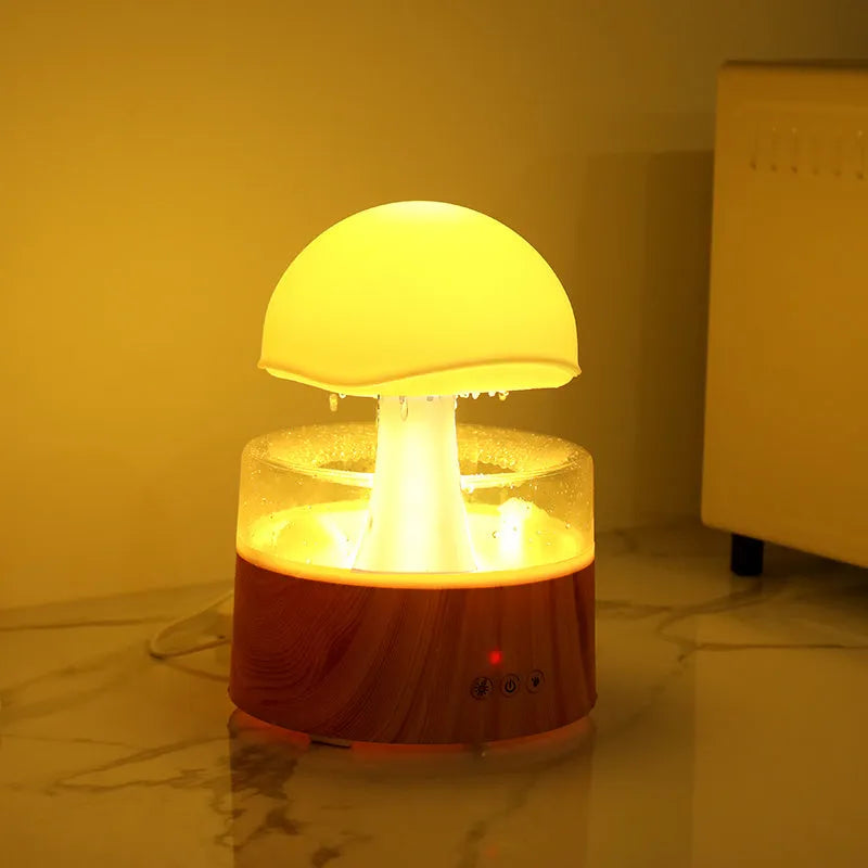 White cloud-shaped humidifier with rainfall effect and colour changing night light