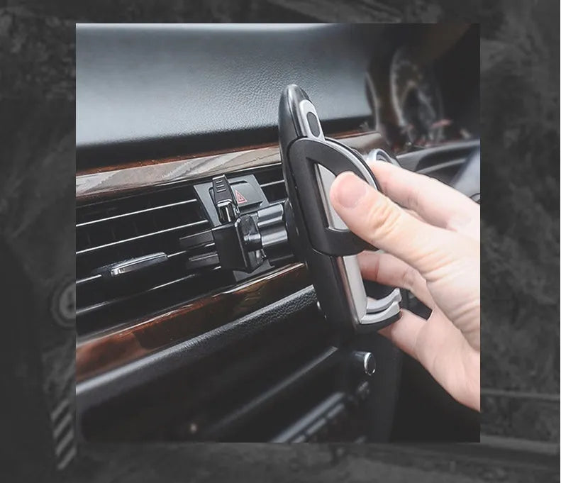 Black plastic car air conditioning outlet mobile phone holder mounted to car vent