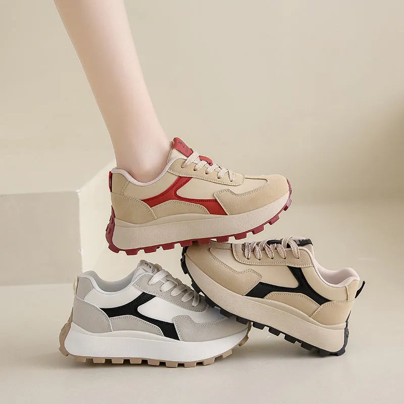 Women's solid colour platform sneakers with lace-up front and flat rubber sole.