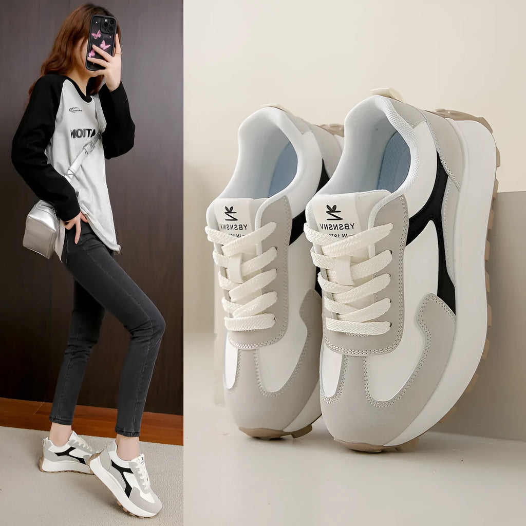 Women's solid colour platform sneakers with lace-up front and flat rubber sole.