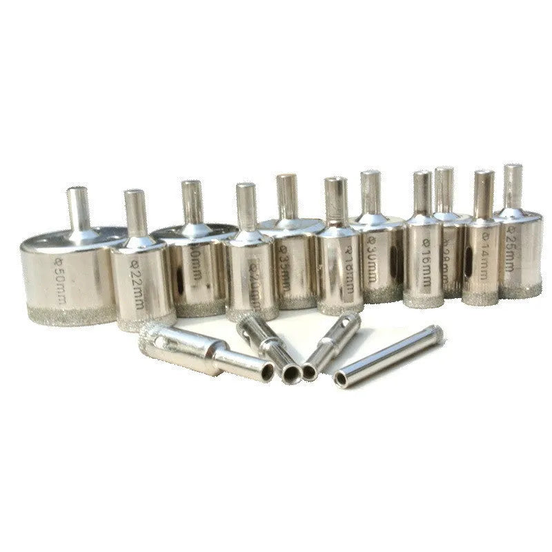 Electroplated tile rock plate drill bit set with one-piece steel construction on a work surface