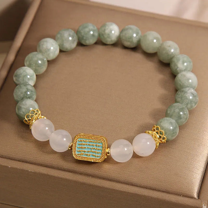 Women's oil green emerald crystal bracelet showing five engraved scripture sections